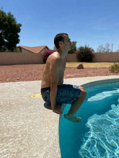 A man doing Hip Lifts in a pool