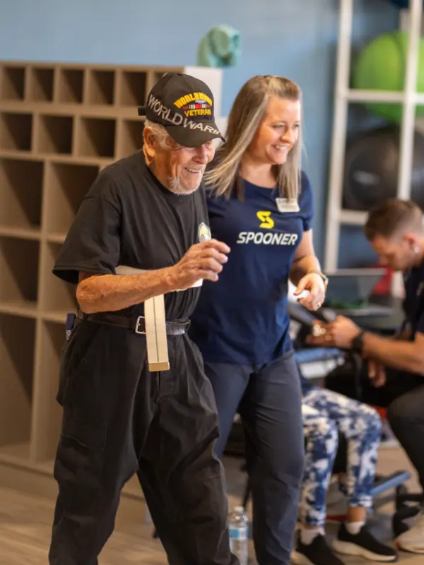 A therapist working with an older man.