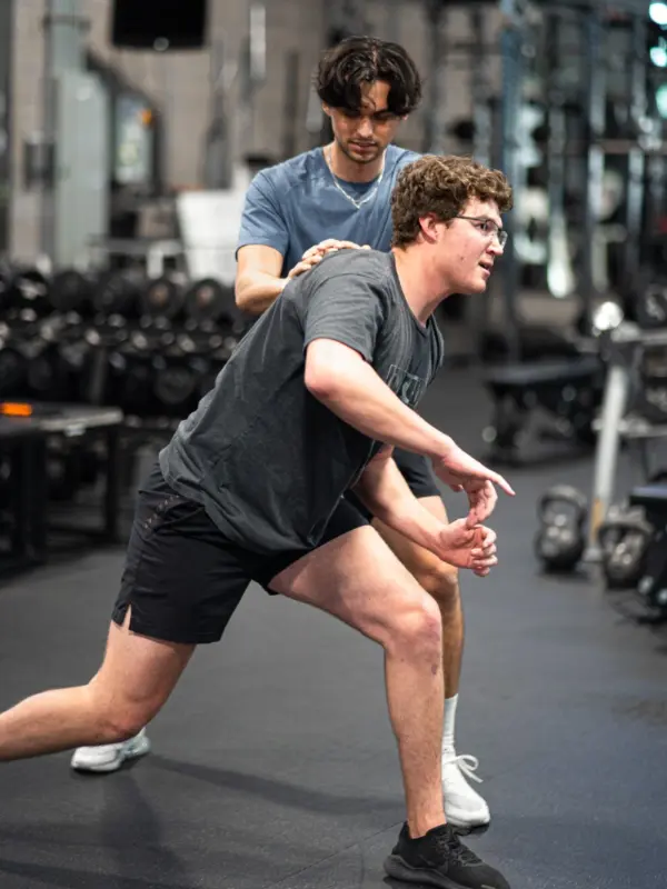 A physical therapy tech helping a patient.