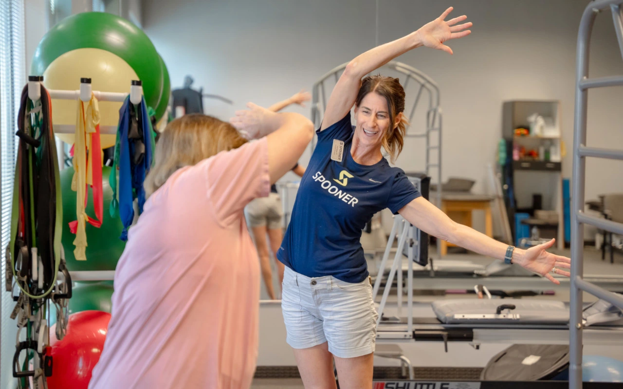Gail Kaiser showing a patient and exercise.