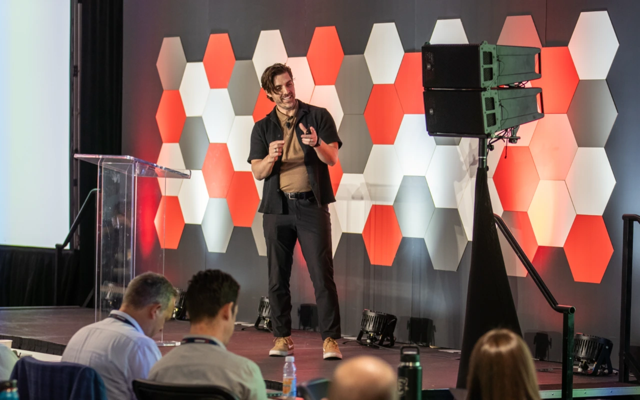 Jess Elis speaking at the Huddle 2025