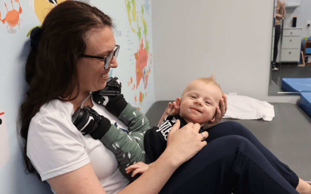Jessica Noel helping baby with torticollis