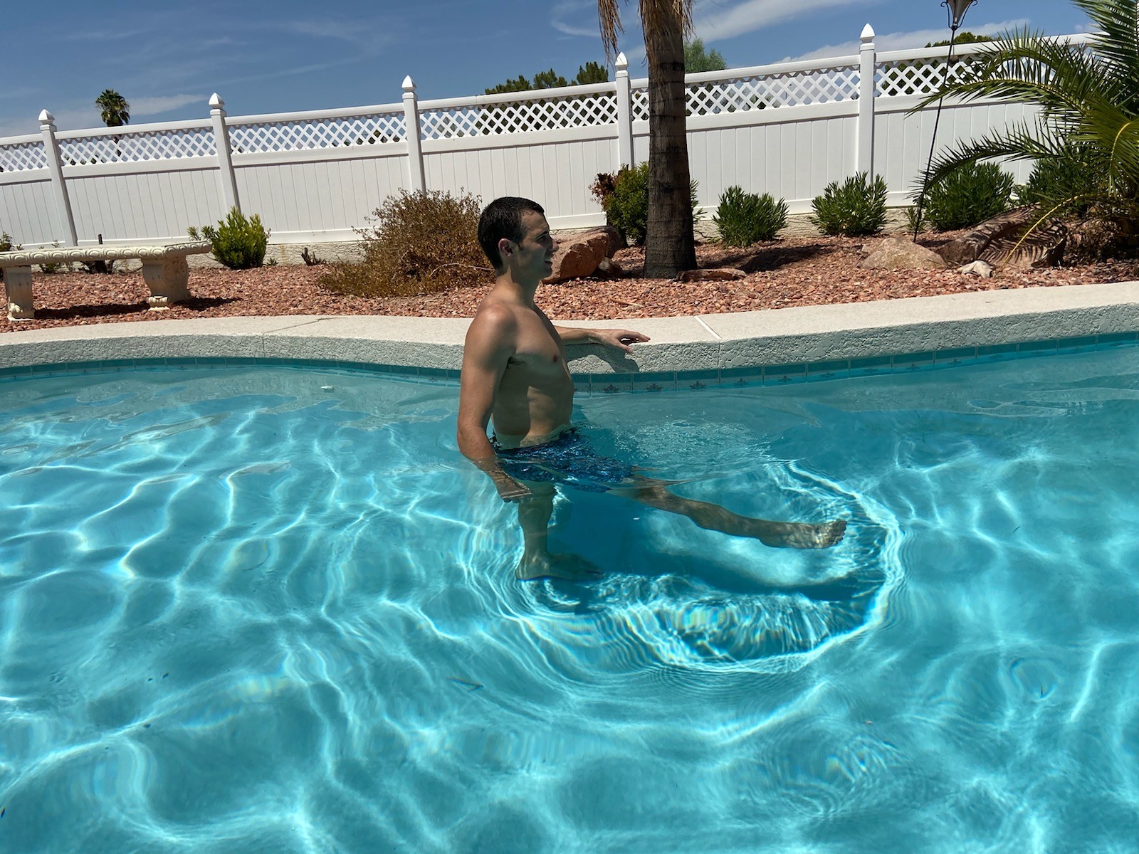 A man doing Bicycle Kicks in a pool.
