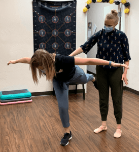 therapist demonstrating pre-pointe assessment