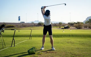 A man swinging a golf club.