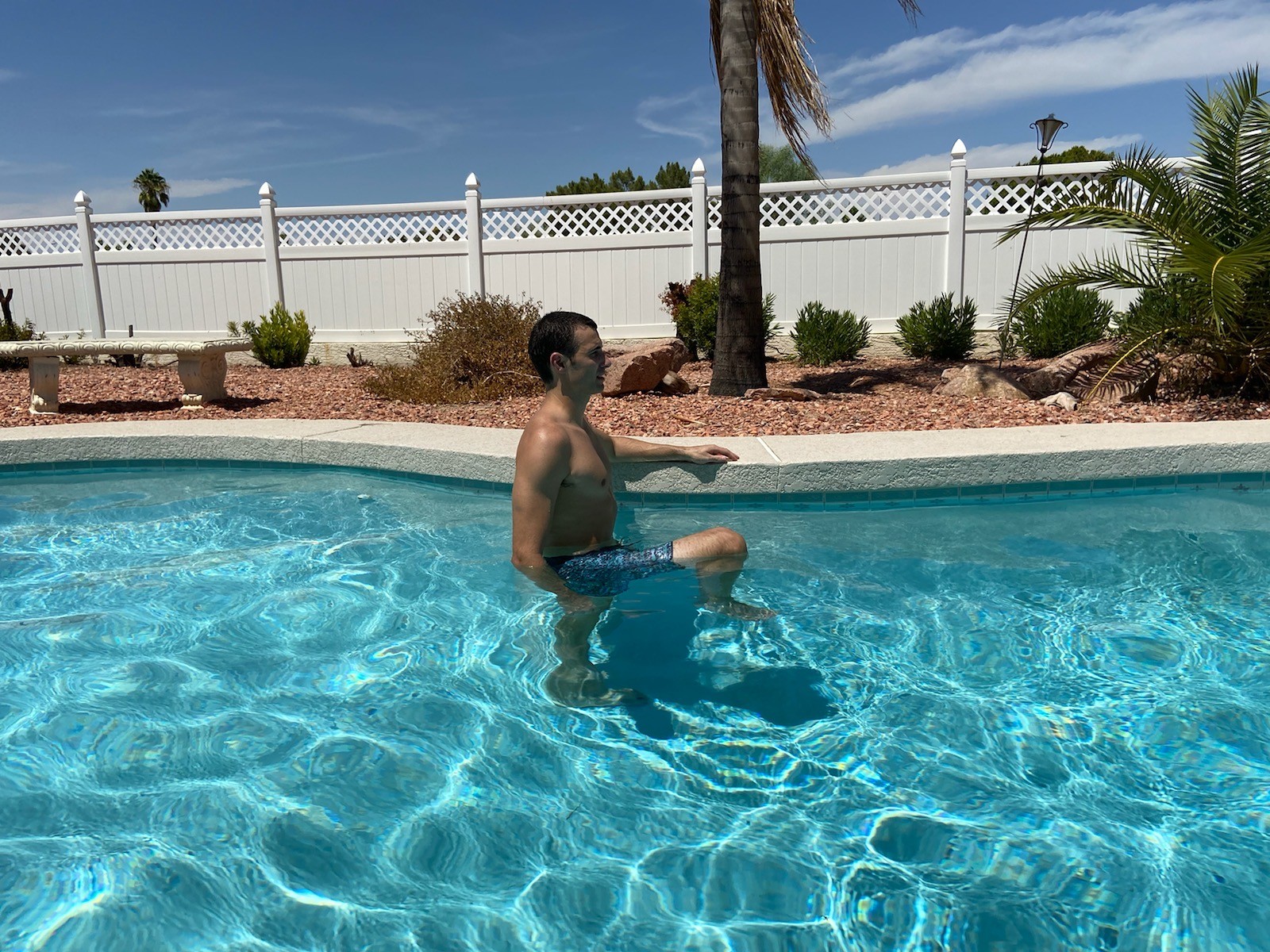 A man doing Bicycle Kicks in a pool.