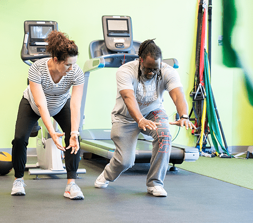 Carrie_Blog_Supplement Image of a man bending over reaching for his toes.