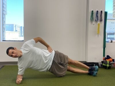 A man doing a side Plank.