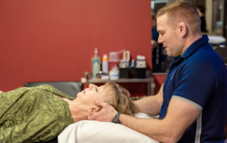 Ben Kelto working on a patient suffering from tension headaches.