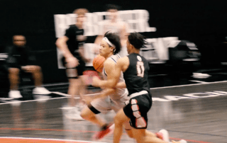 Two basketball players on the court.