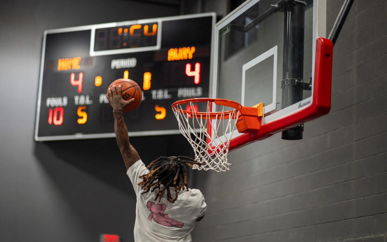 A man dunking a basketball.