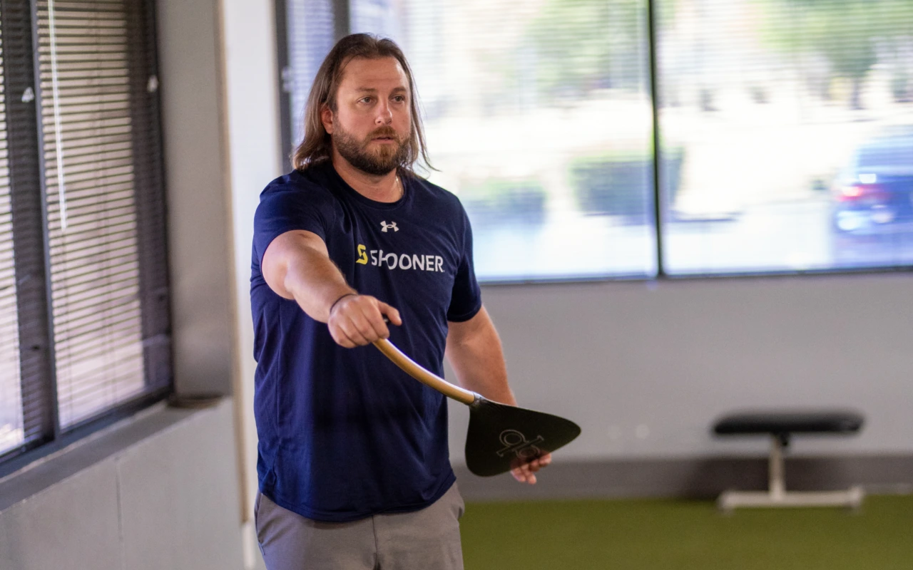 A physical therapist doing paddle exercises.