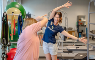 Gail Kaiser showing a patient and exercise.