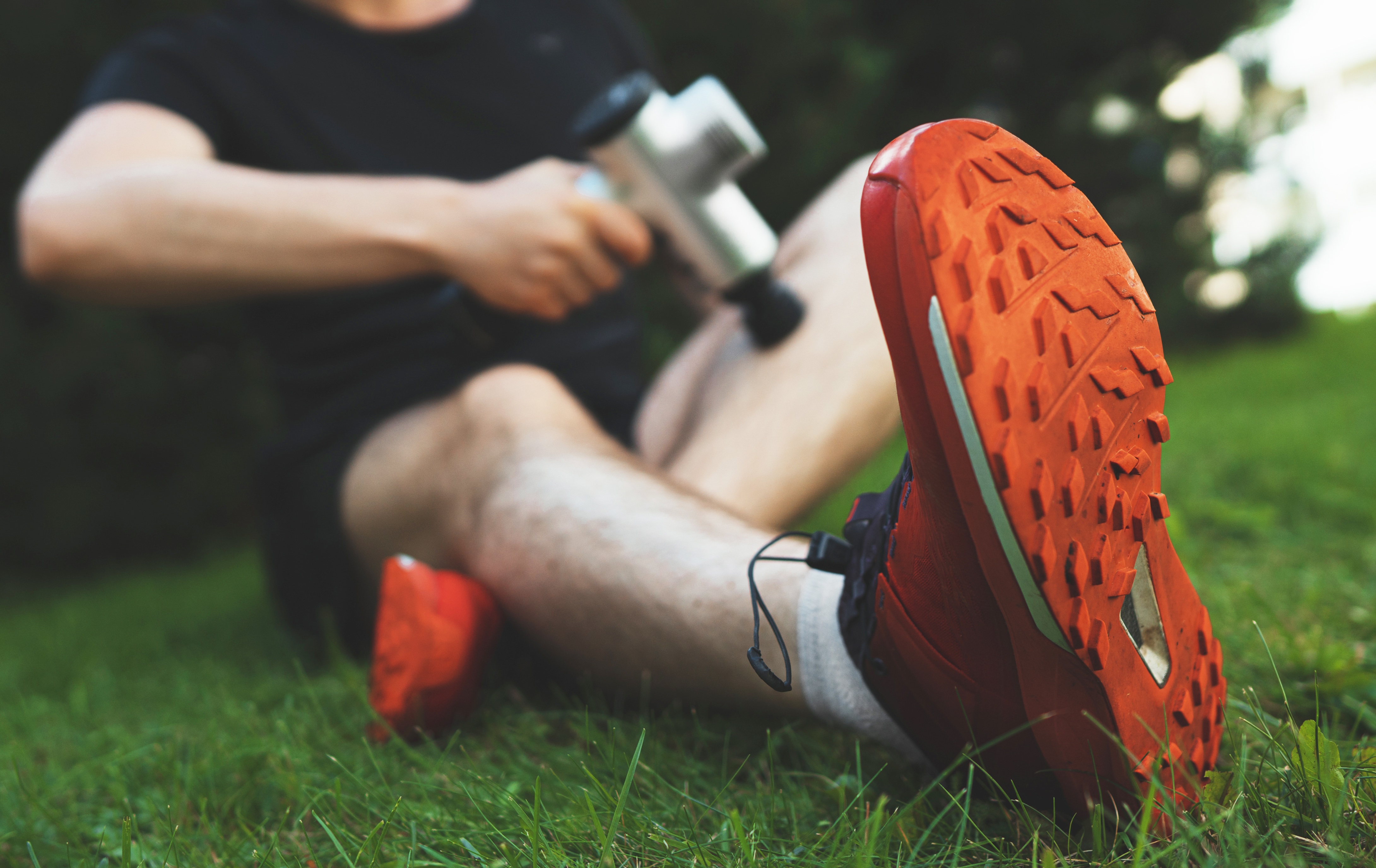 athlete using percussive device