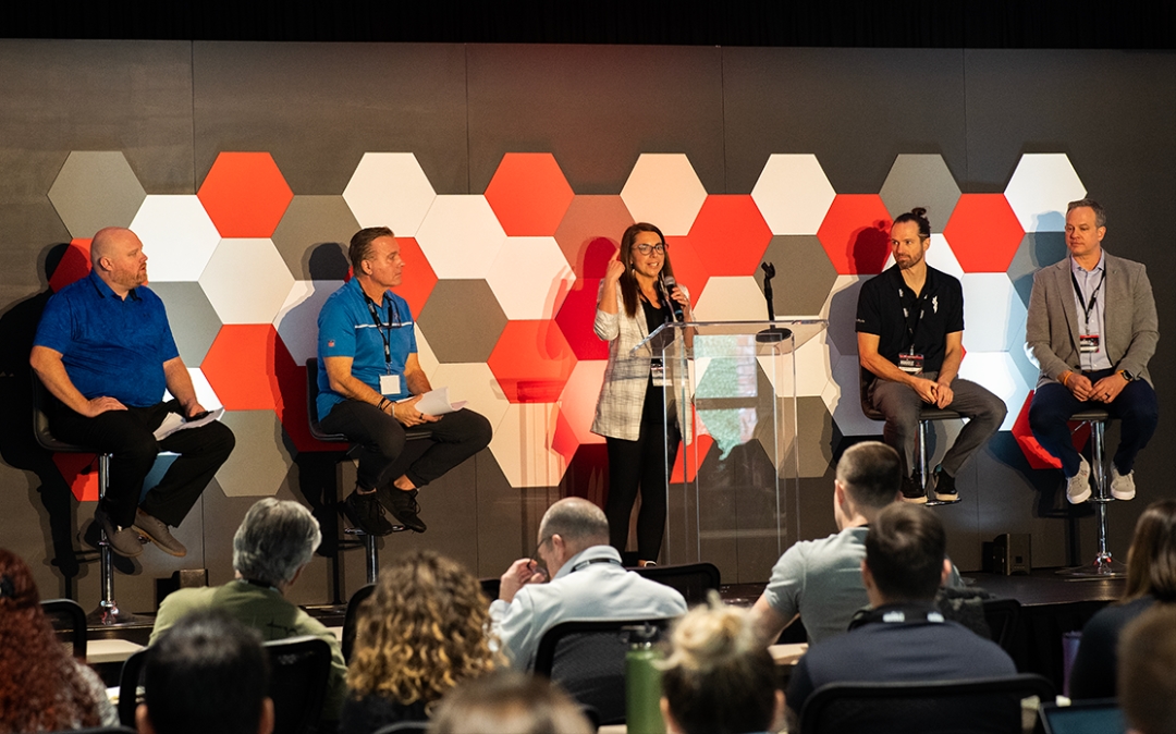 Feature image of a panel of presenters answering questions.
