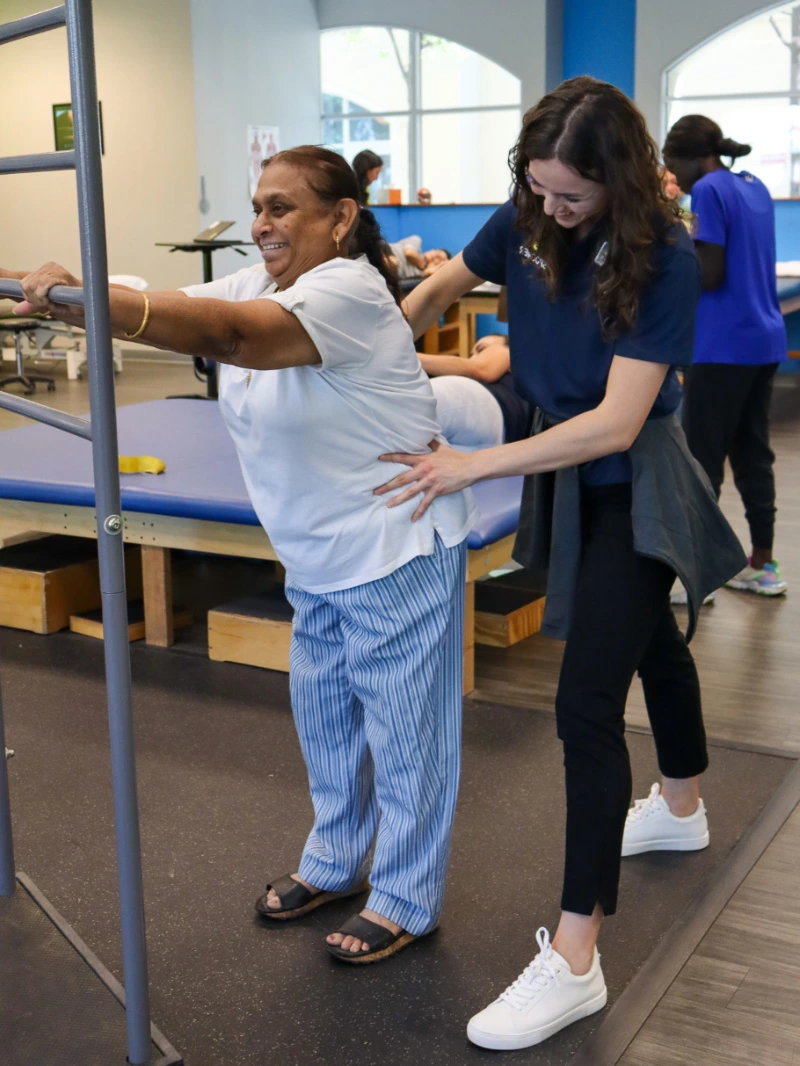 Image of a therapist treating a patient with spinal cord injury.