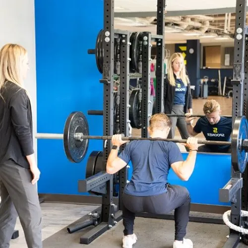 out-Exercises for Runners Body Image Image of a man performing a squat press.