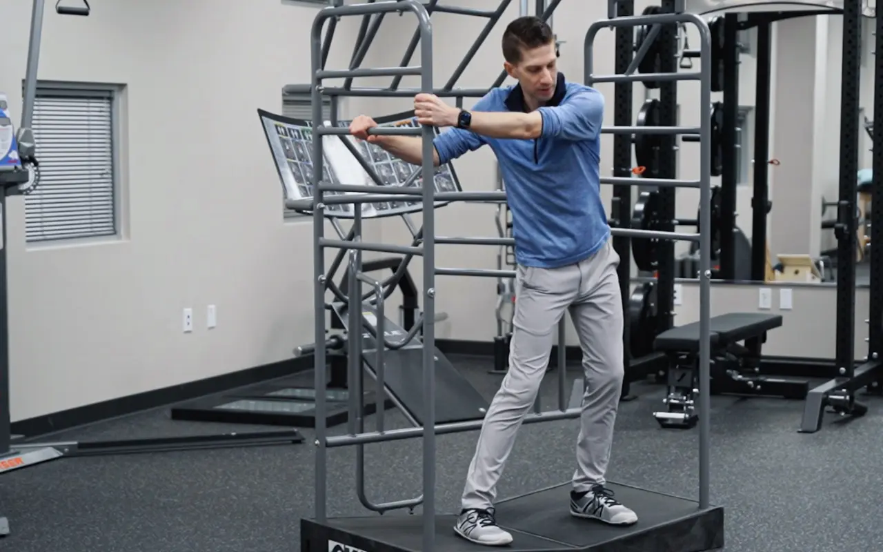 Brian Schulte stretching in a stretch cage.