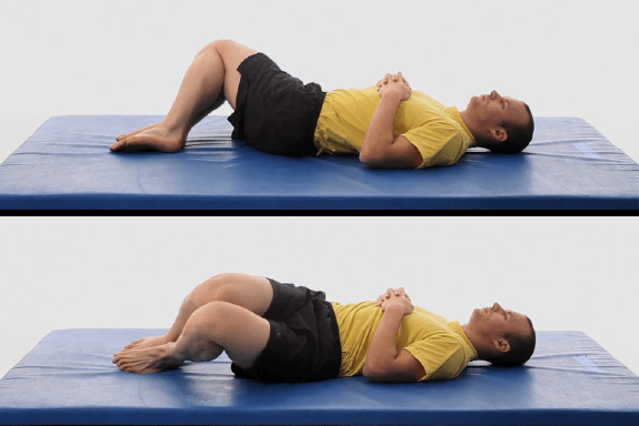 Man performs LOWER TRUNK ROTATIONS.