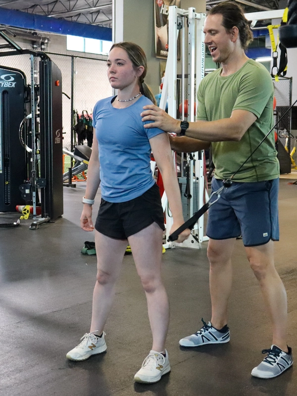 Teen-image-2-2 Image of a teen kneeling with a tension band around his leg.