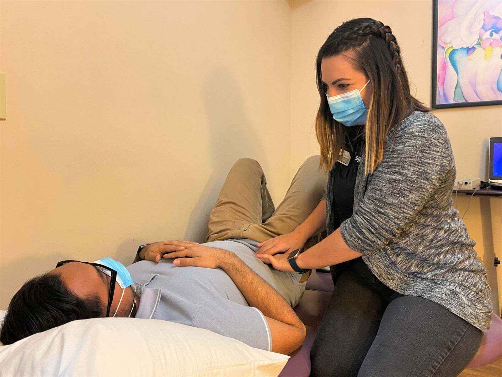 A man getting a pelvic exam after a prostatectomy.