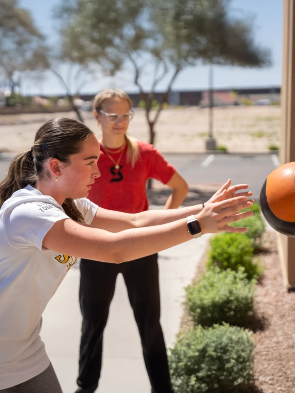 Molly Alhemeier coaching a teen athlete
