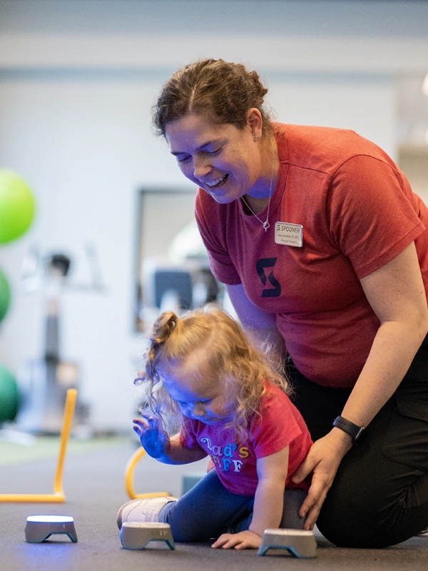Image of a toddler on a bosu ball.