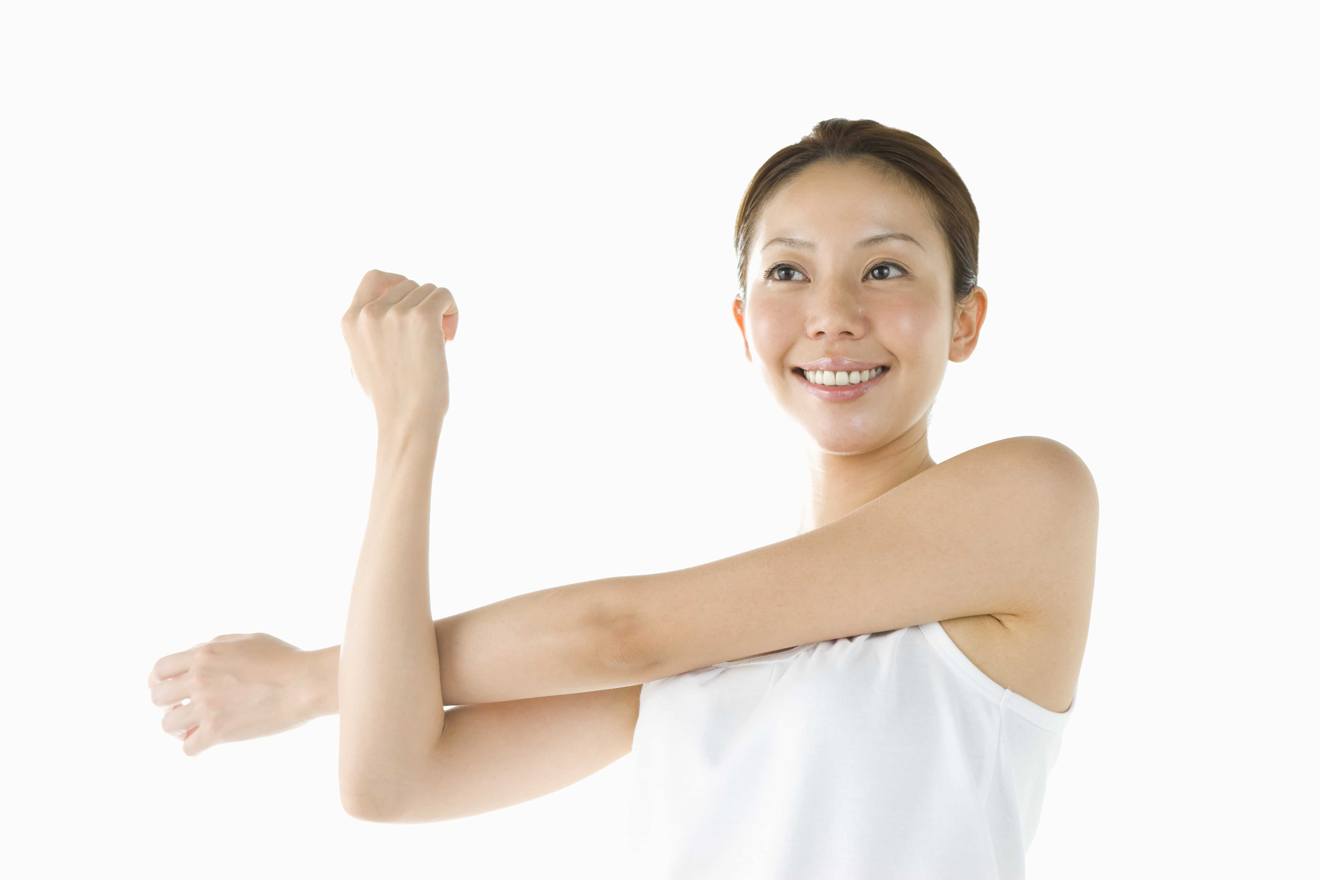 Woman doing a cross arm stretch.