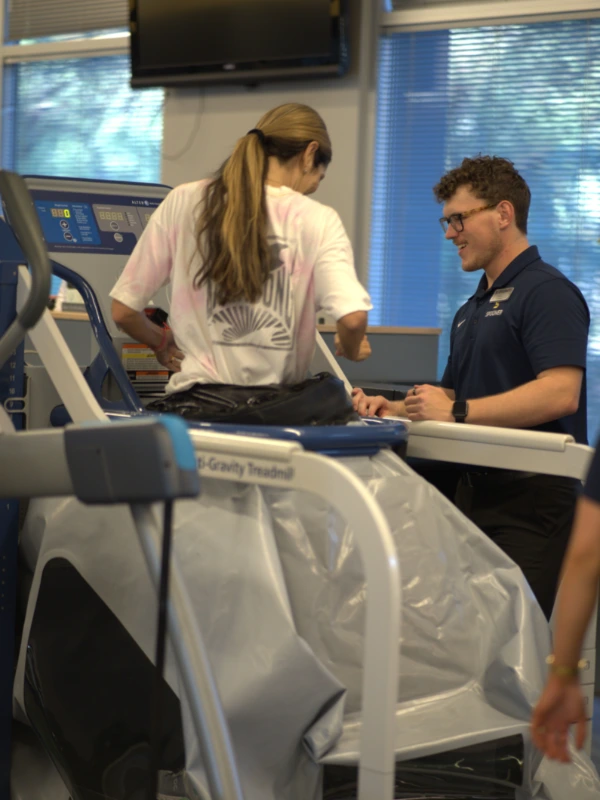 Image of a man running in an alter g treadmill