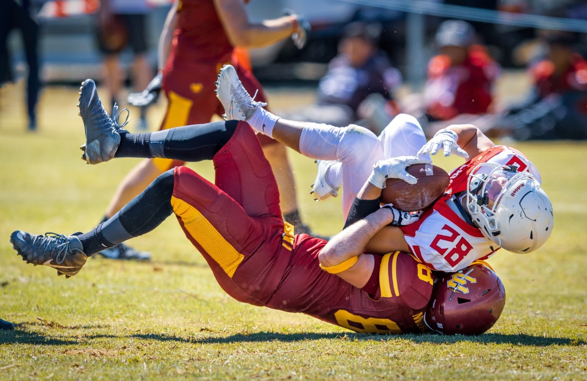 Football player take a hard hit