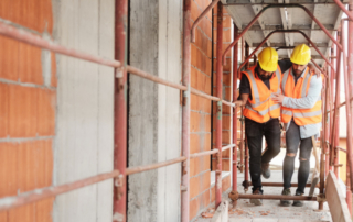 construction worker heling injured coworker