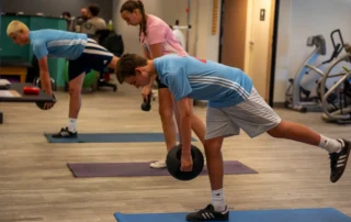 A group of young athletes in a spooner sports training camp training at a spooner clinic.