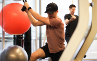 Feature image of a man doing rotational pull downs.