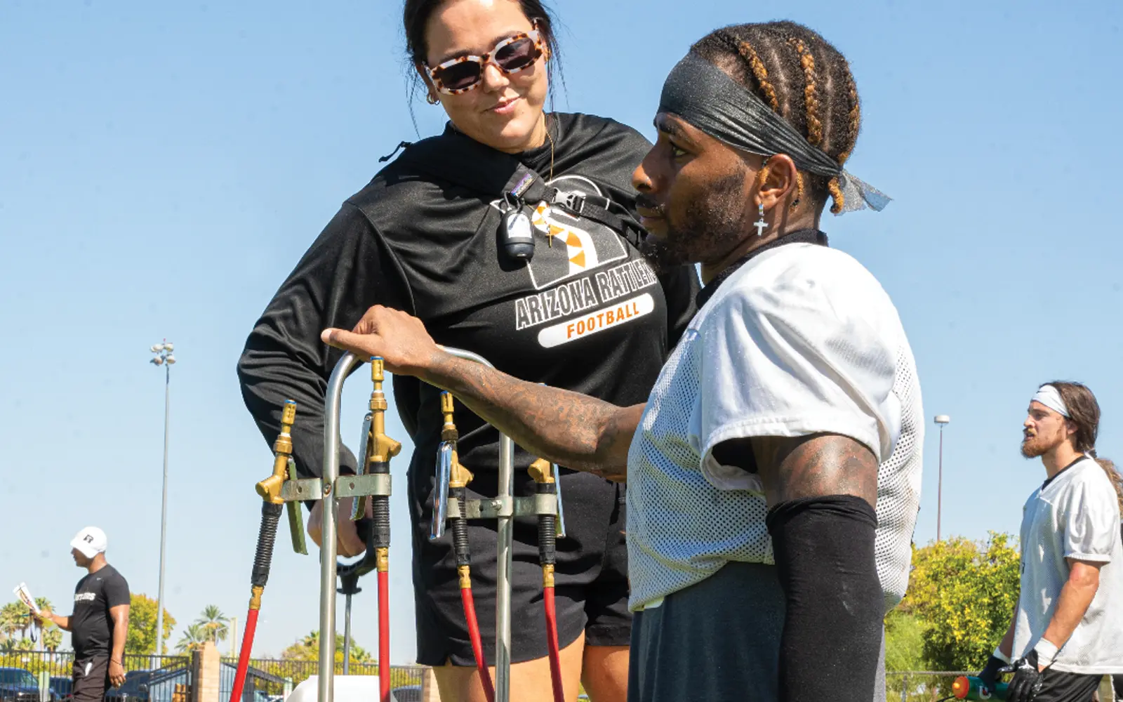 Feature image of a Rattlers team member with Gabbie Miller in the background.