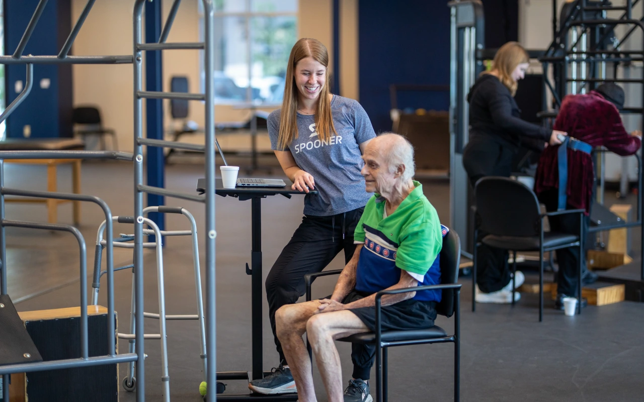 An elderly man taking a break from his physical therapy.