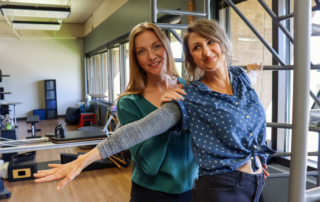 image of occupational therapist with patient smiling