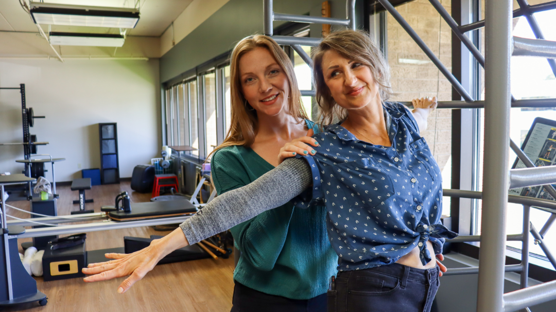 image of occupational therapist with patient smiling