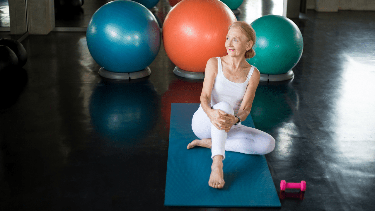 Senior woman on yoga mat