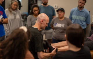 John Kline, PT, DPT examining an ankle at a Foot and Ankle education course.