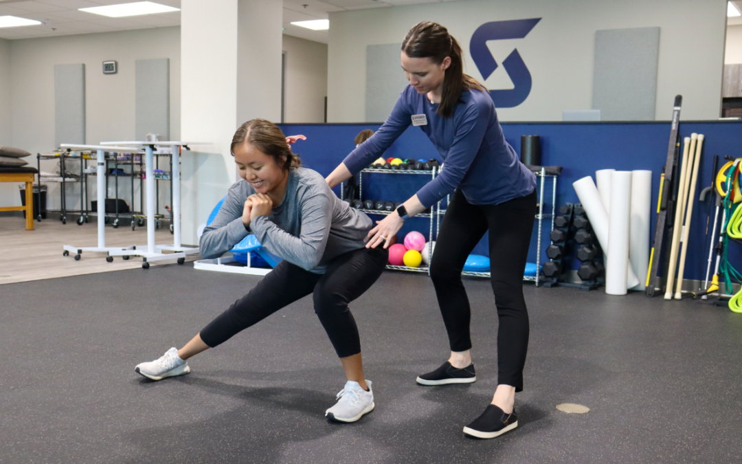 Image of Michelle Reed helping a patient with side walking lunge