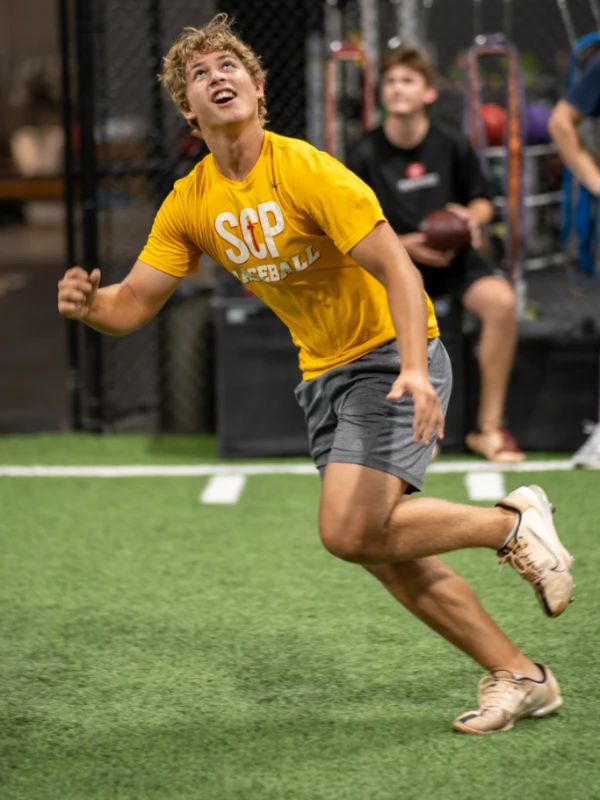 baseball player running on turf