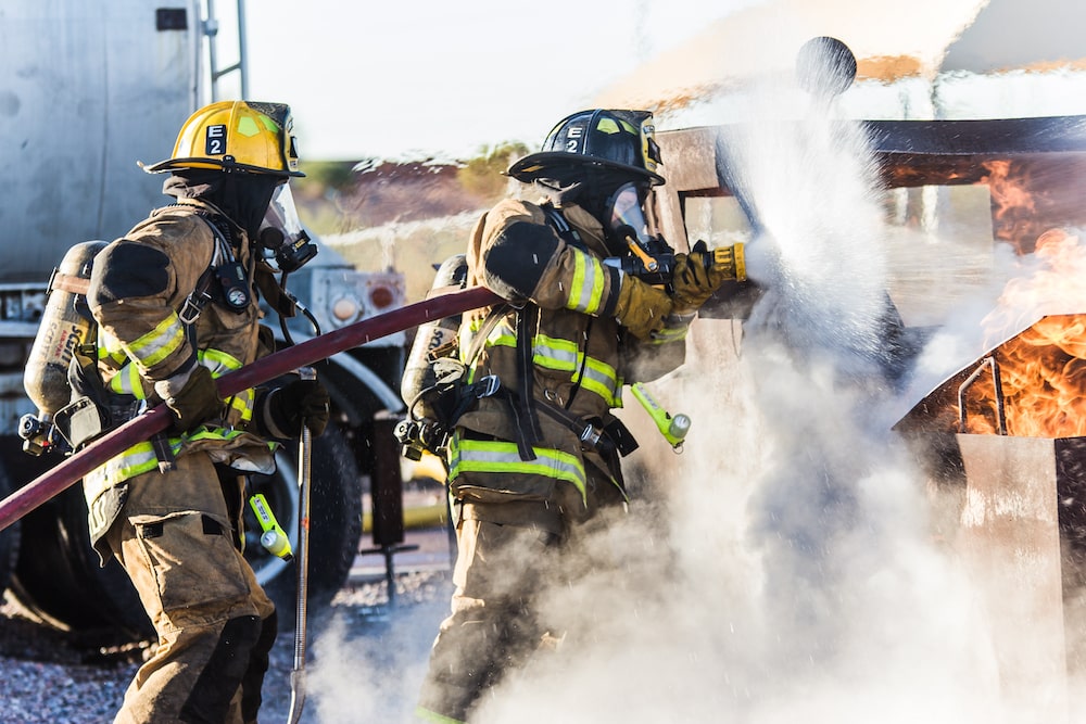 Tactical Athlete - Firefighters putting out a fire