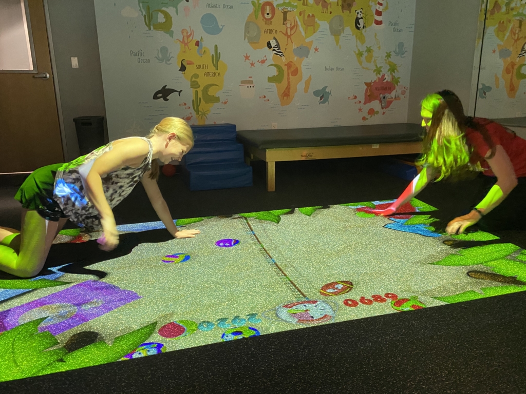 children play on beam interactive projector