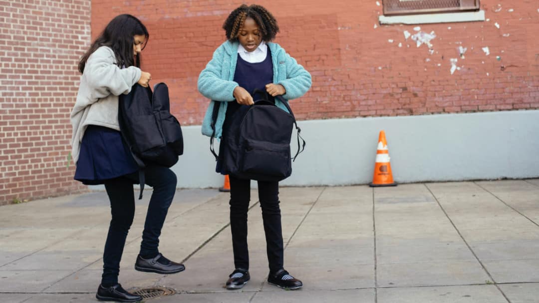 Children with heavy backpacks