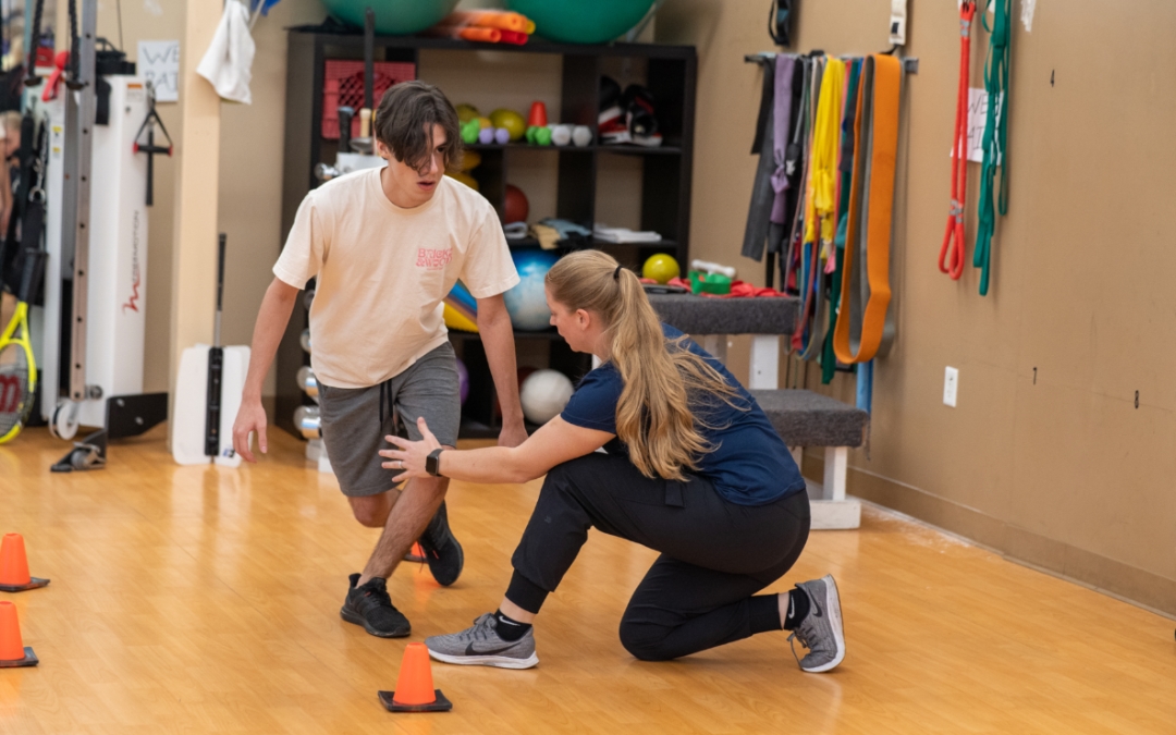 Feature image of a man with his legs crossed in a balance exercise.