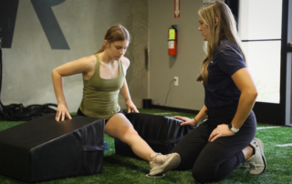 Feature image of an woman testing the flexibility in her legs.