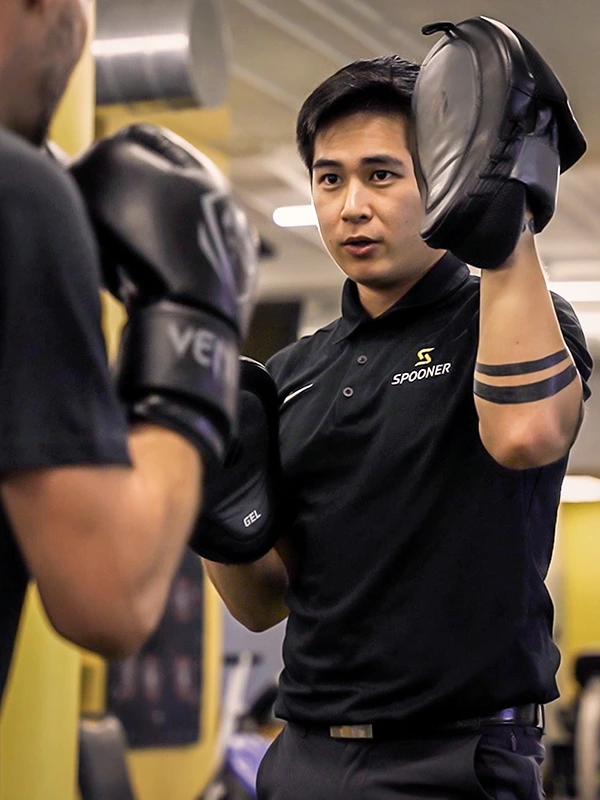 Image of a FIT trainer doing a boxing session with a client.