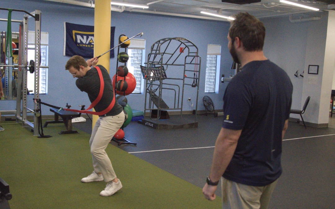 Image of a man in a tension harness practicing a golf swing.