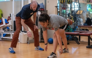 Feature image of a female runner stretching.