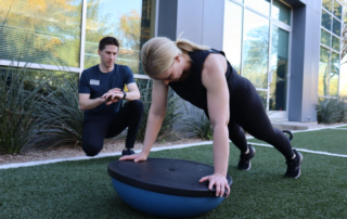 Feature image of a woman doing a pushup on a bosu ball.